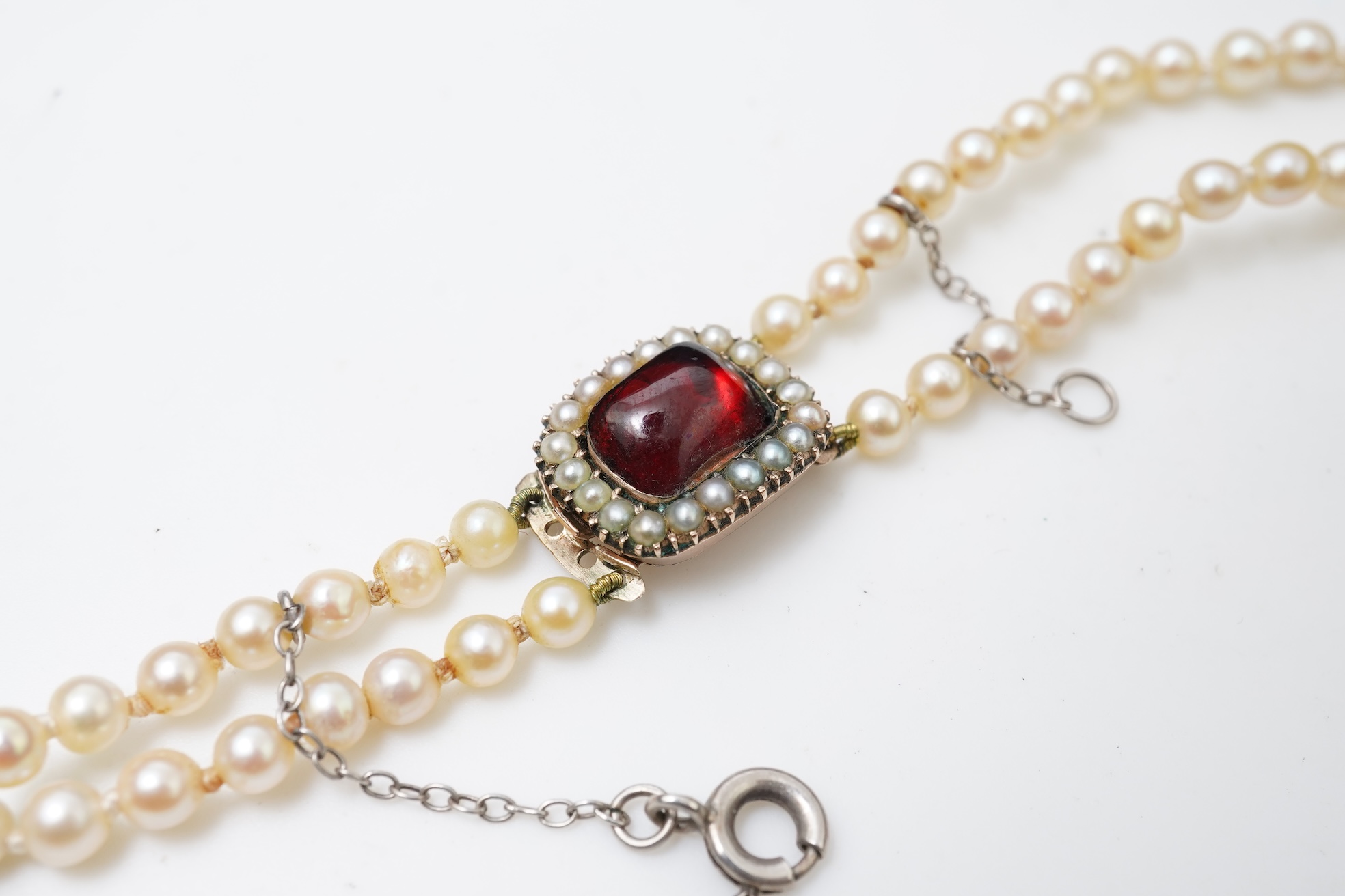 A cultured pearl and garnet necklace, 19th century and later